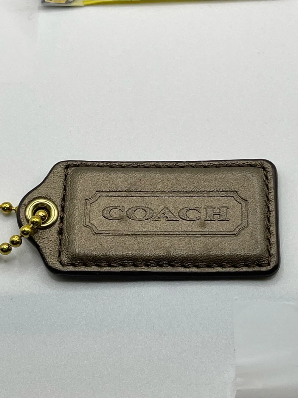 COACH Iridescent Brown Leather Hang Tag with Gold Chain